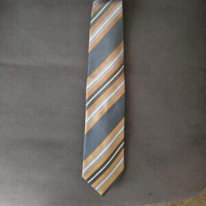 Diagonal striped tie in brown gold